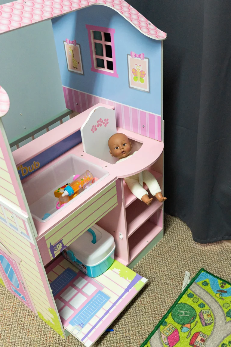 Pretend play dollhouse in a preschool classroom